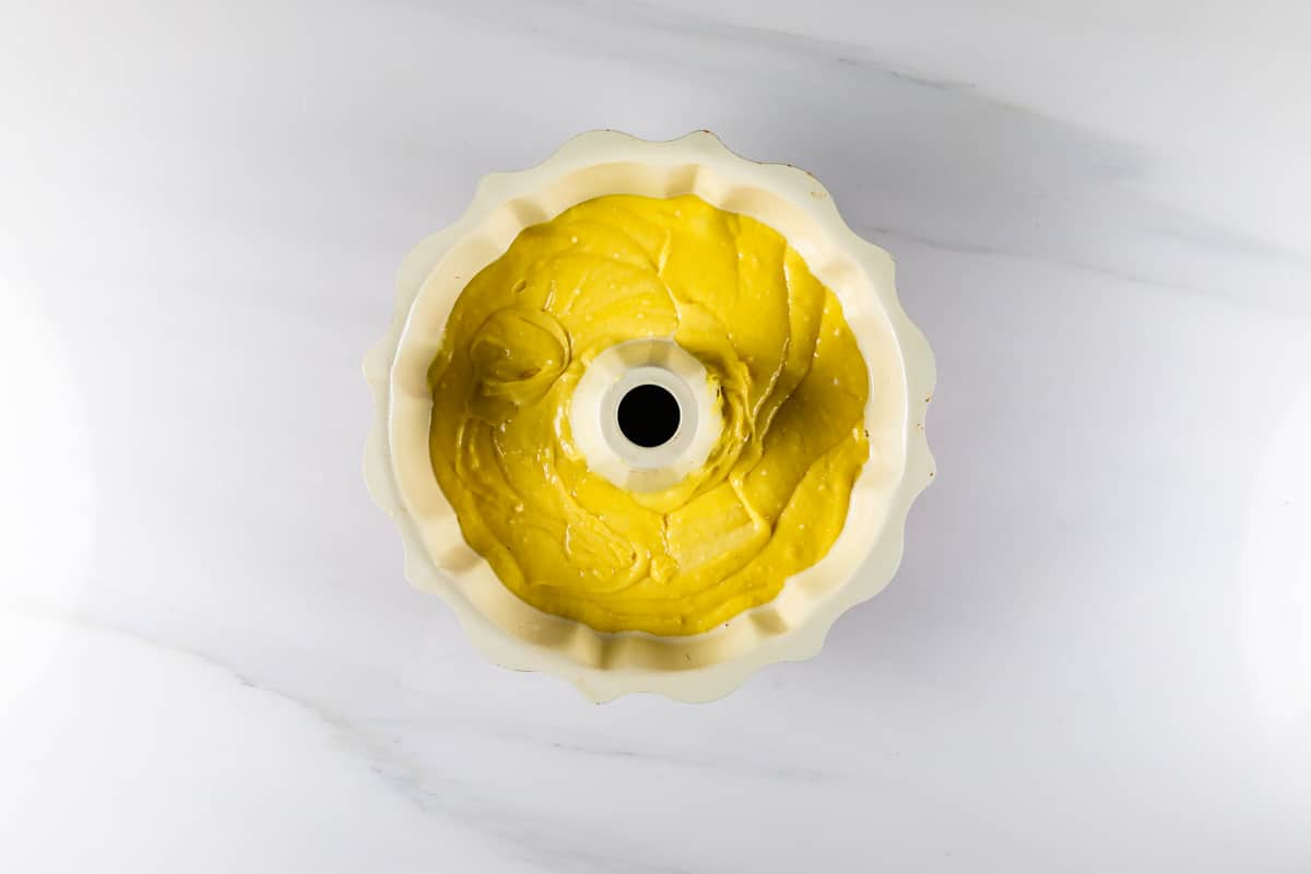 process shot of lemon bundt cake being made.