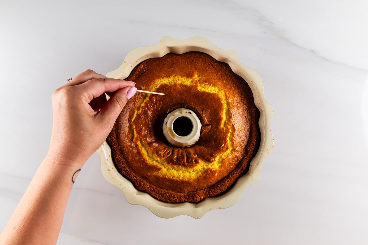 process shot of lemon bundt cake being made.