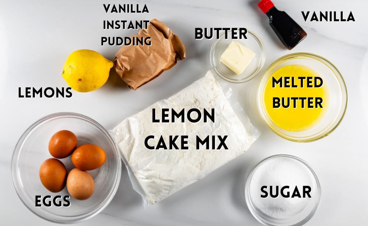 ingredients in lemon bundt cake laid out on a white marble counter.