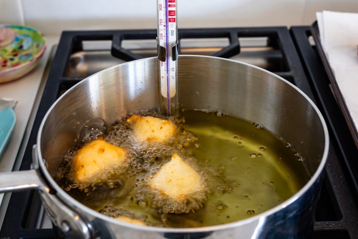 process shot of donut holes being made.