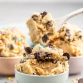 cookie dough mixed with chocolate chips in pastel colored bowls.