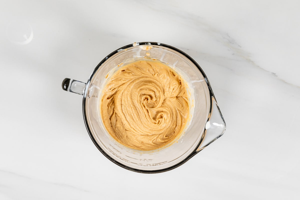 process shot of chocolate peanut butter cupcakes being made.