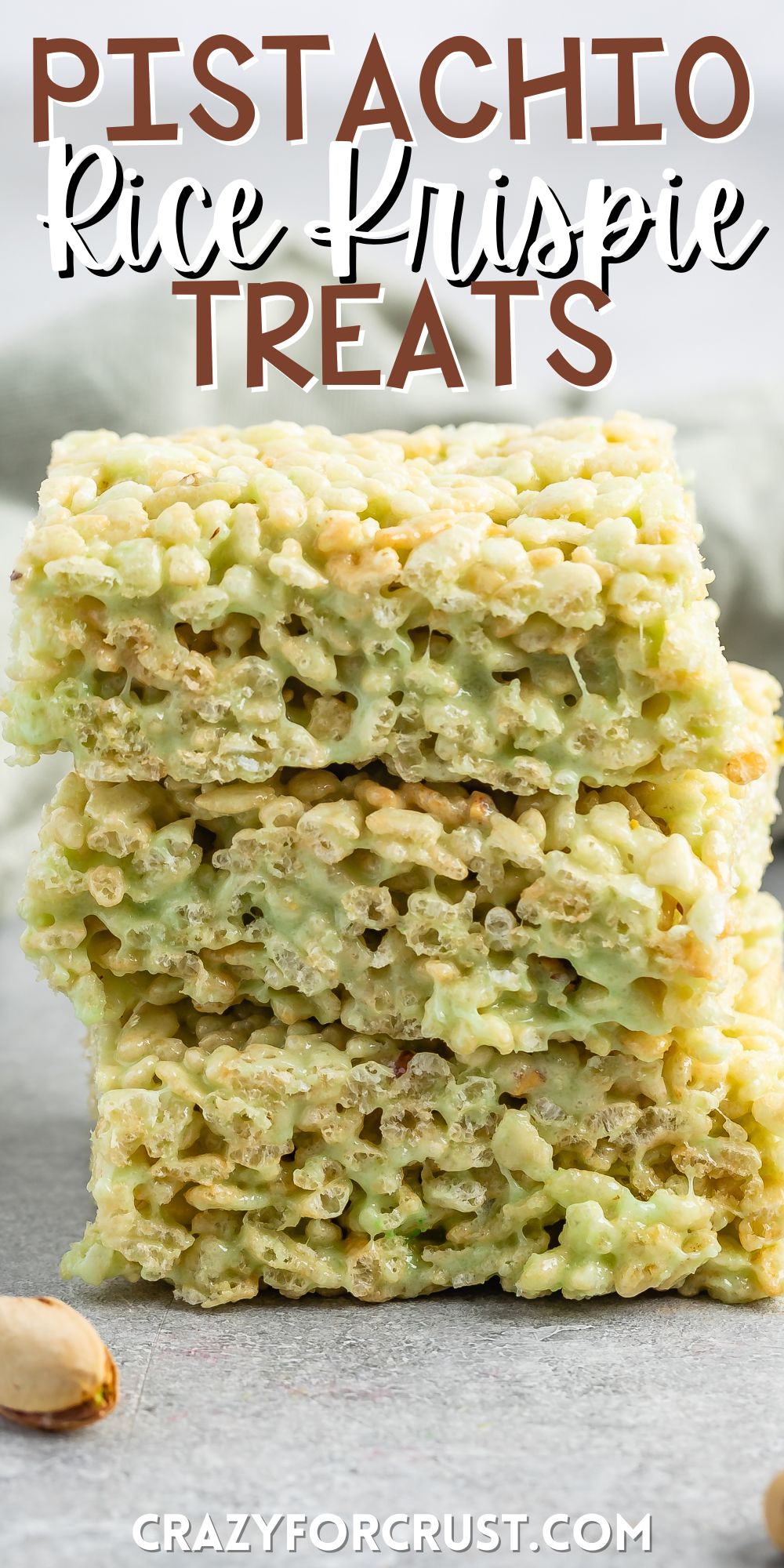 stacked green Rice Krispie treats on a grey table with words on the image.