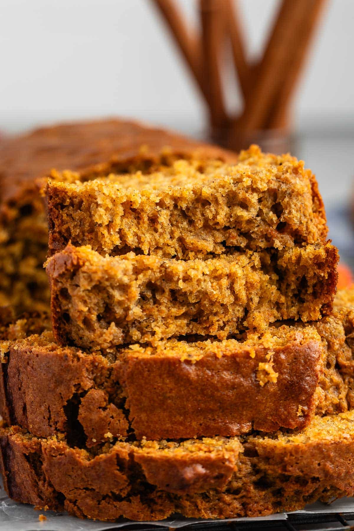 sliced banana bread on a drying rack.