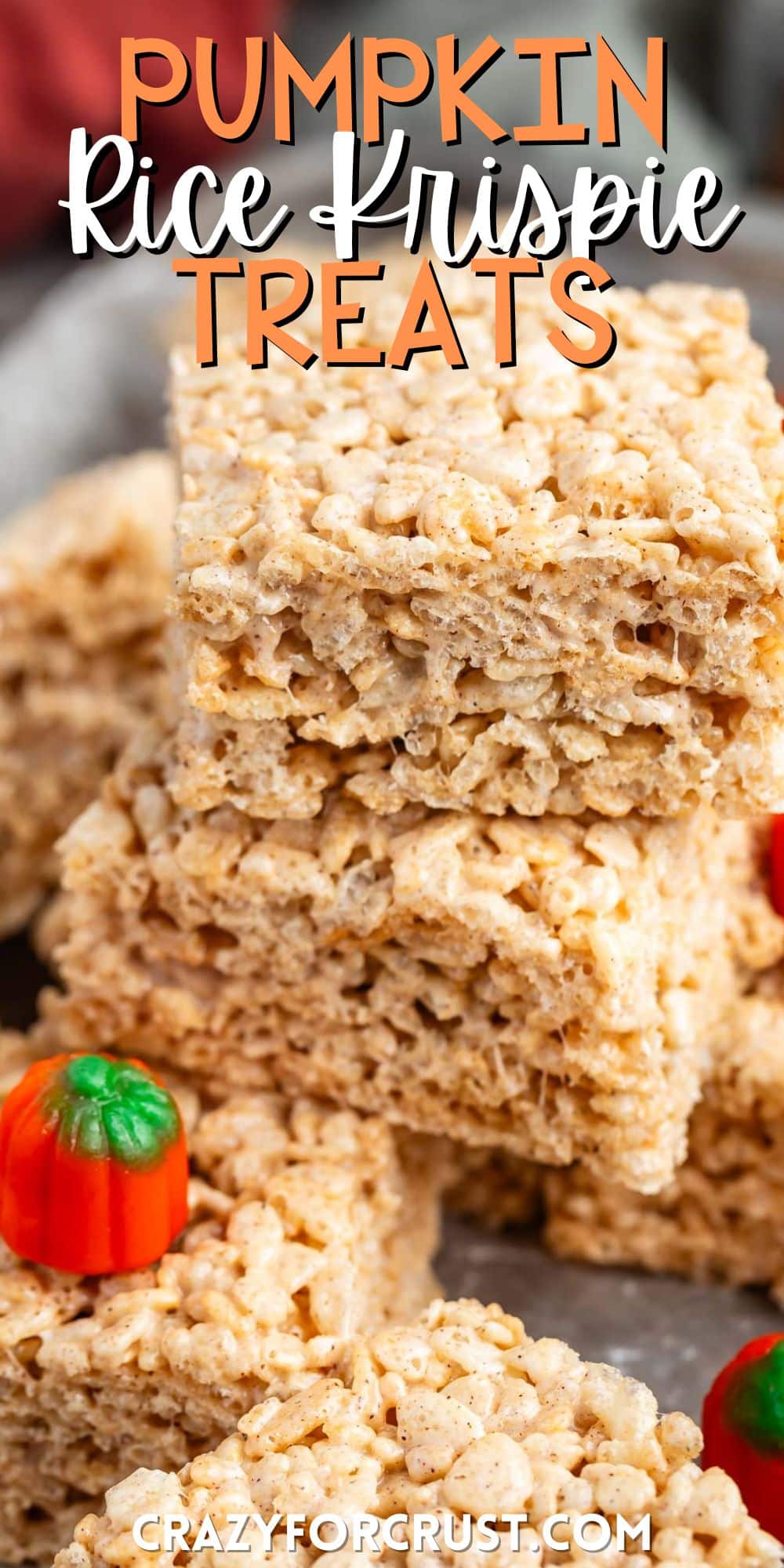 stacked Rice Krispie treats surrounded by pumpkin candy corn with words on the image.