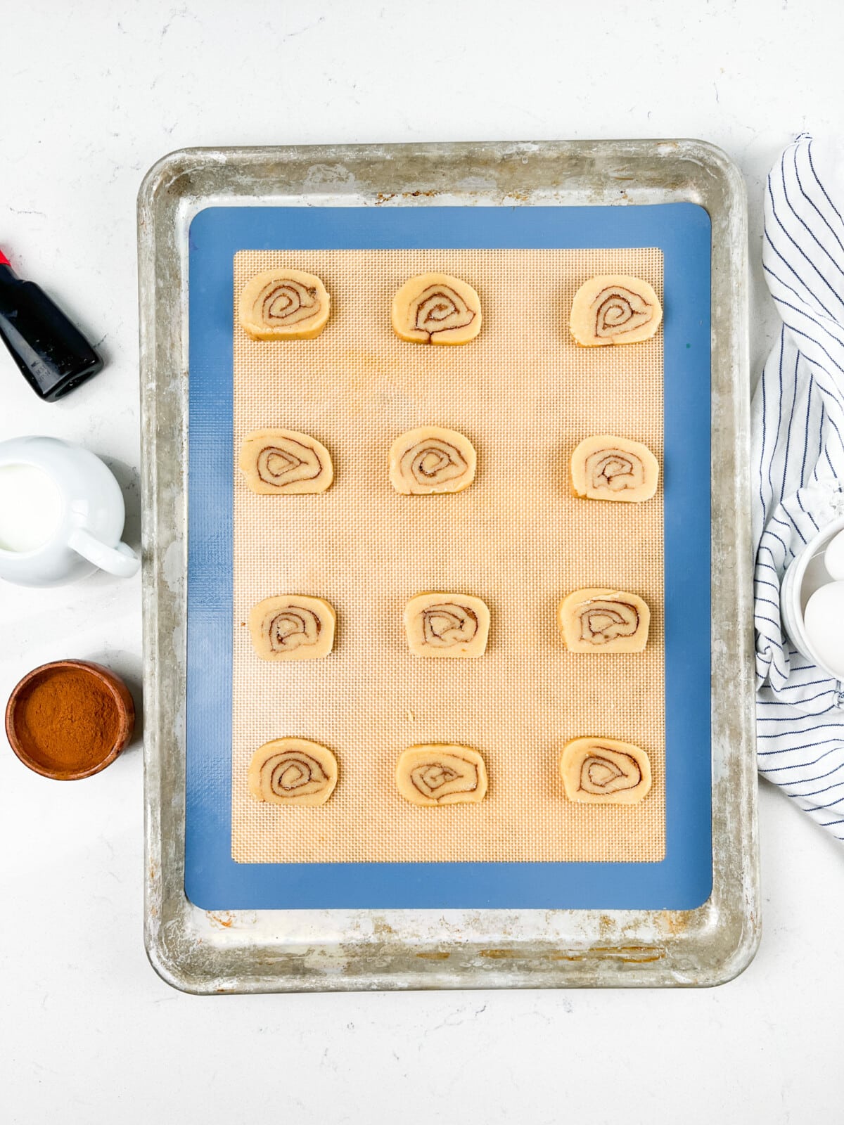 process shots of cinnamon roll cookies being made.