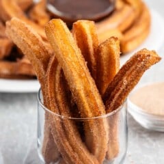 churros placed together in a clear bowl.