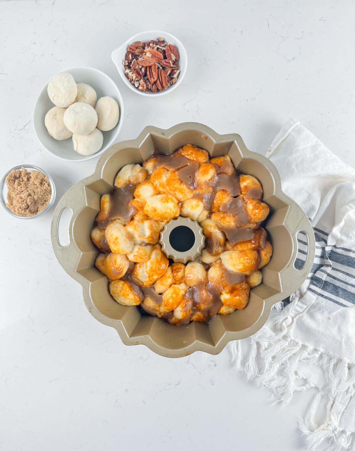 process shot of caramel monkey bread being made.