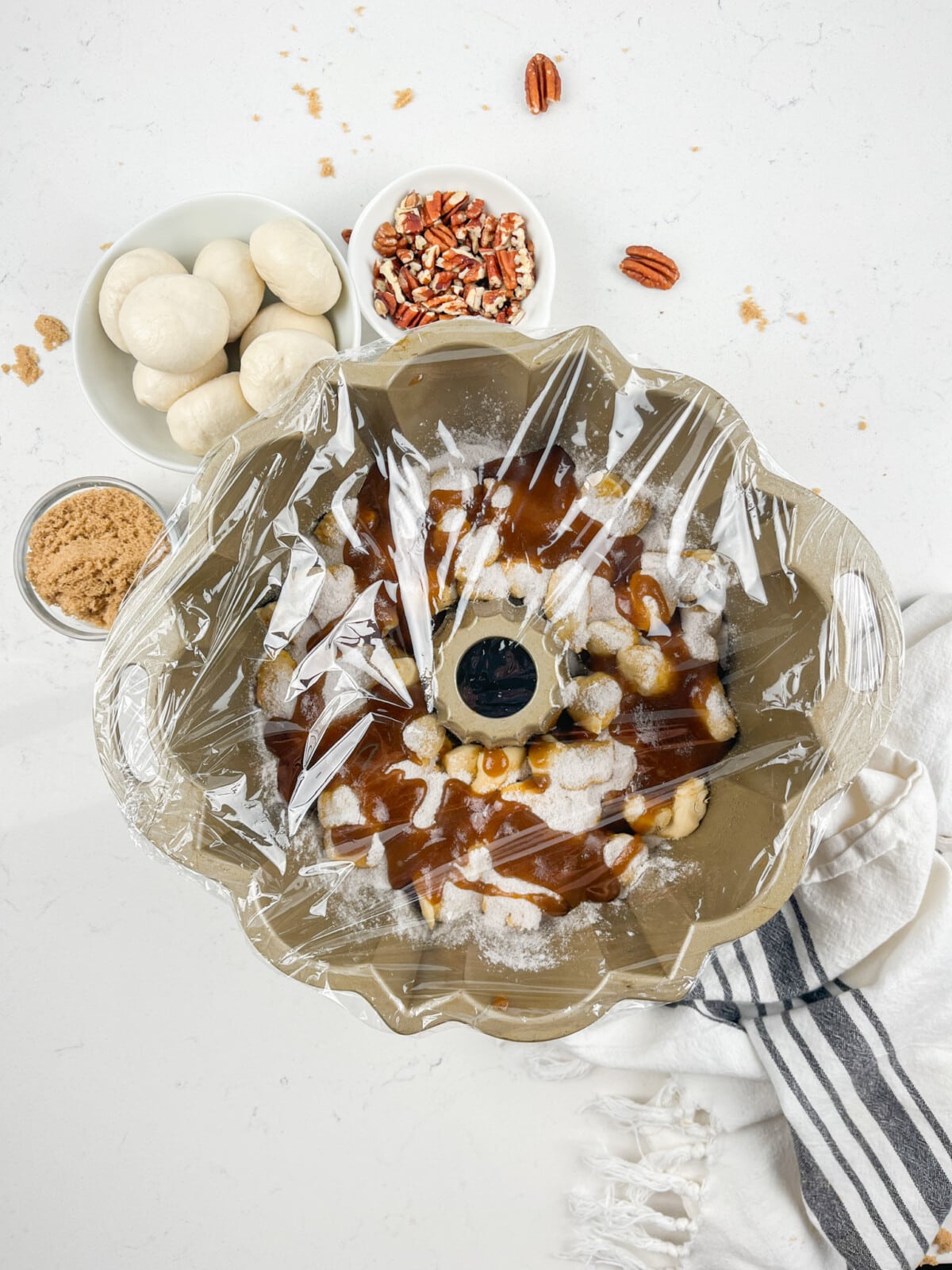 process shot of caramel monkey bread being made.