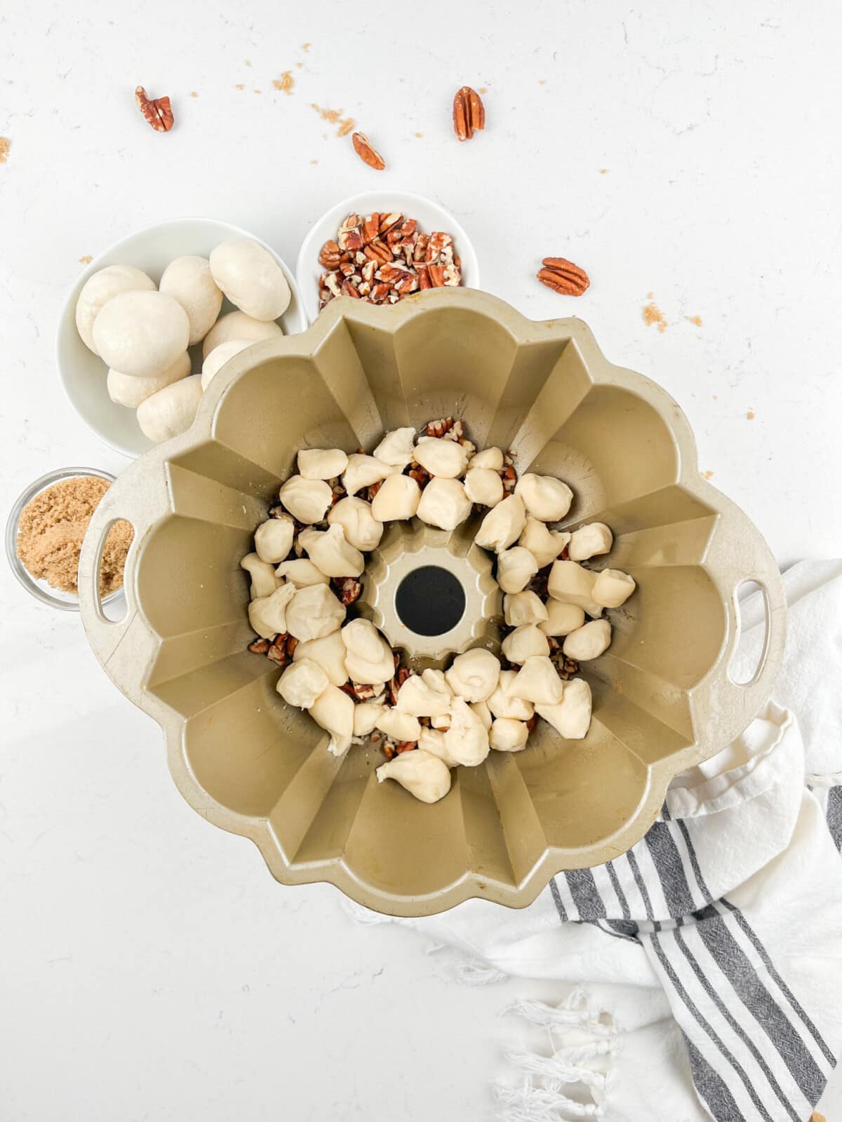 process shot of caramel monkey bread being made.