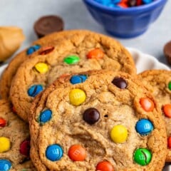 stacked peanut butter cookies with M&Ms baked into the cookies.