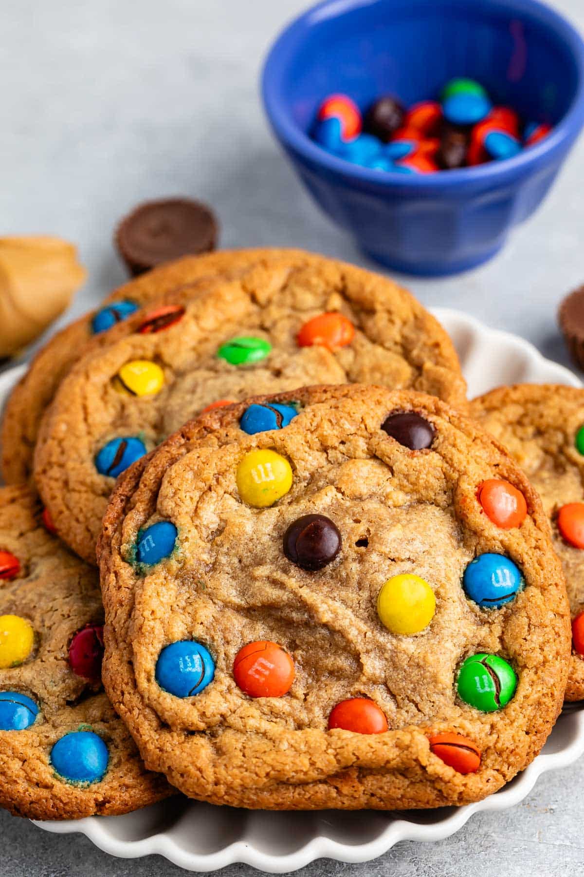 stacked peanut butter cookies with M&Ms baked into the cookies.