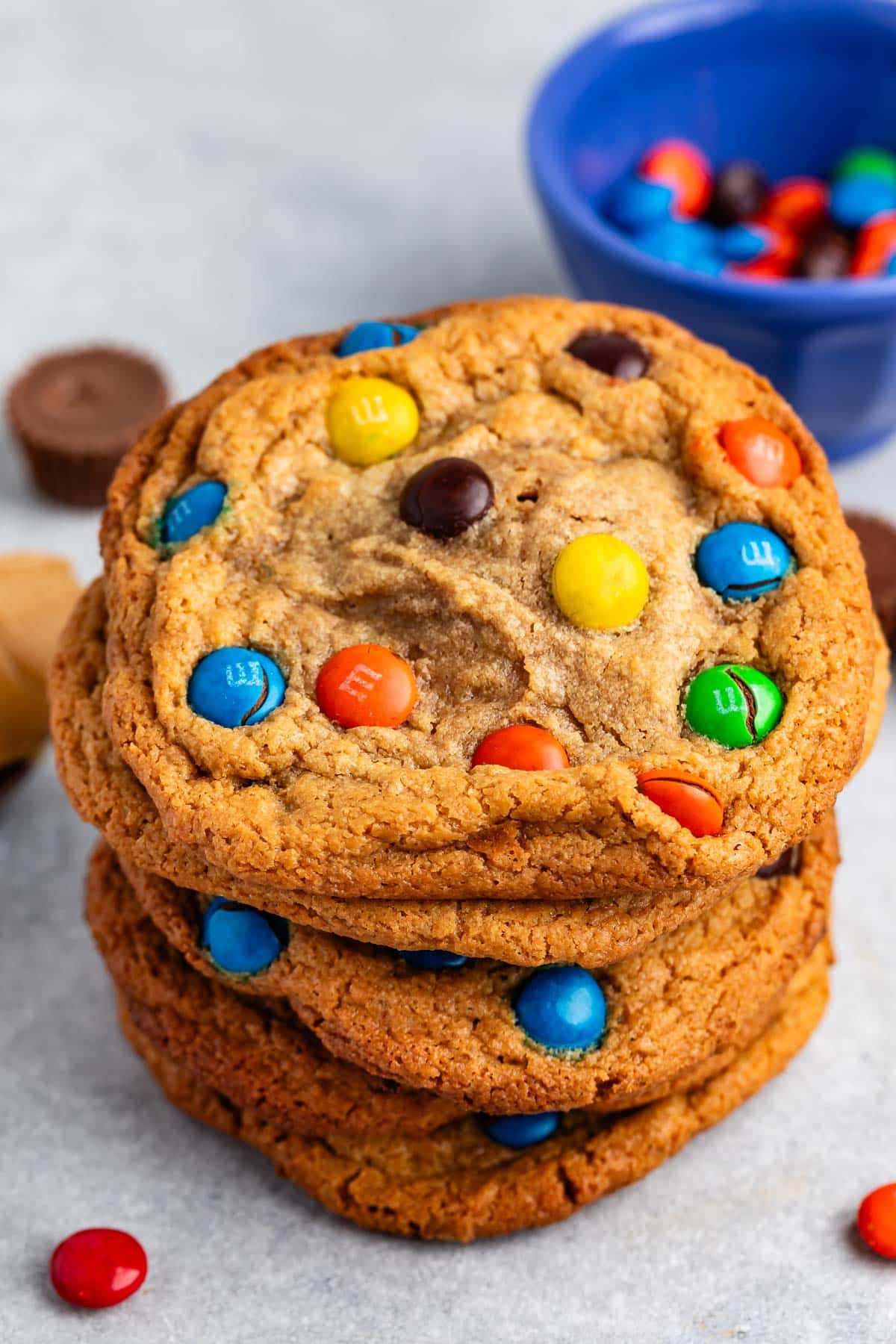 stacked peanut butter cookies with M&Ms baked into the cookies.