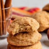 stacked snickerdoodles on a grey surface.