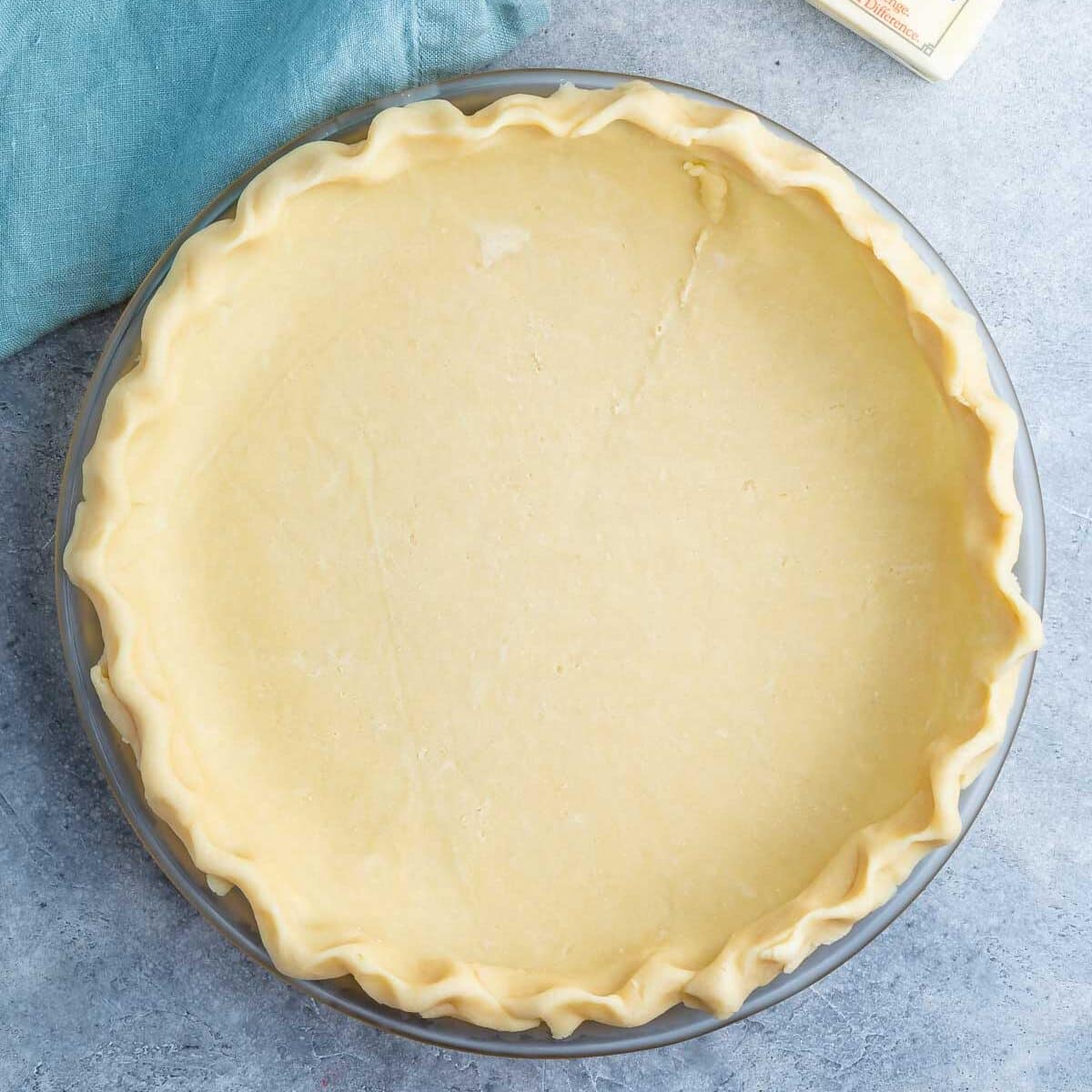 all butter pie crust on gray background.