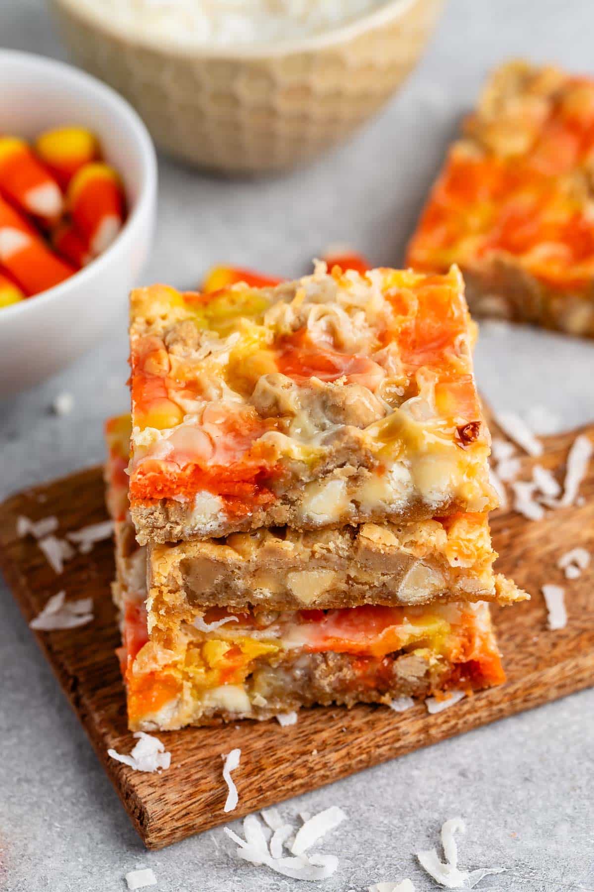 stacked candy corn magic bars with candy corn and coconut baked in.