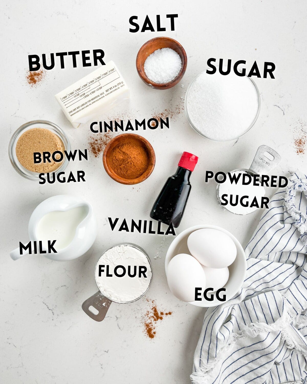 ingredients in cinnamon roll cookies laid out on a white counter.