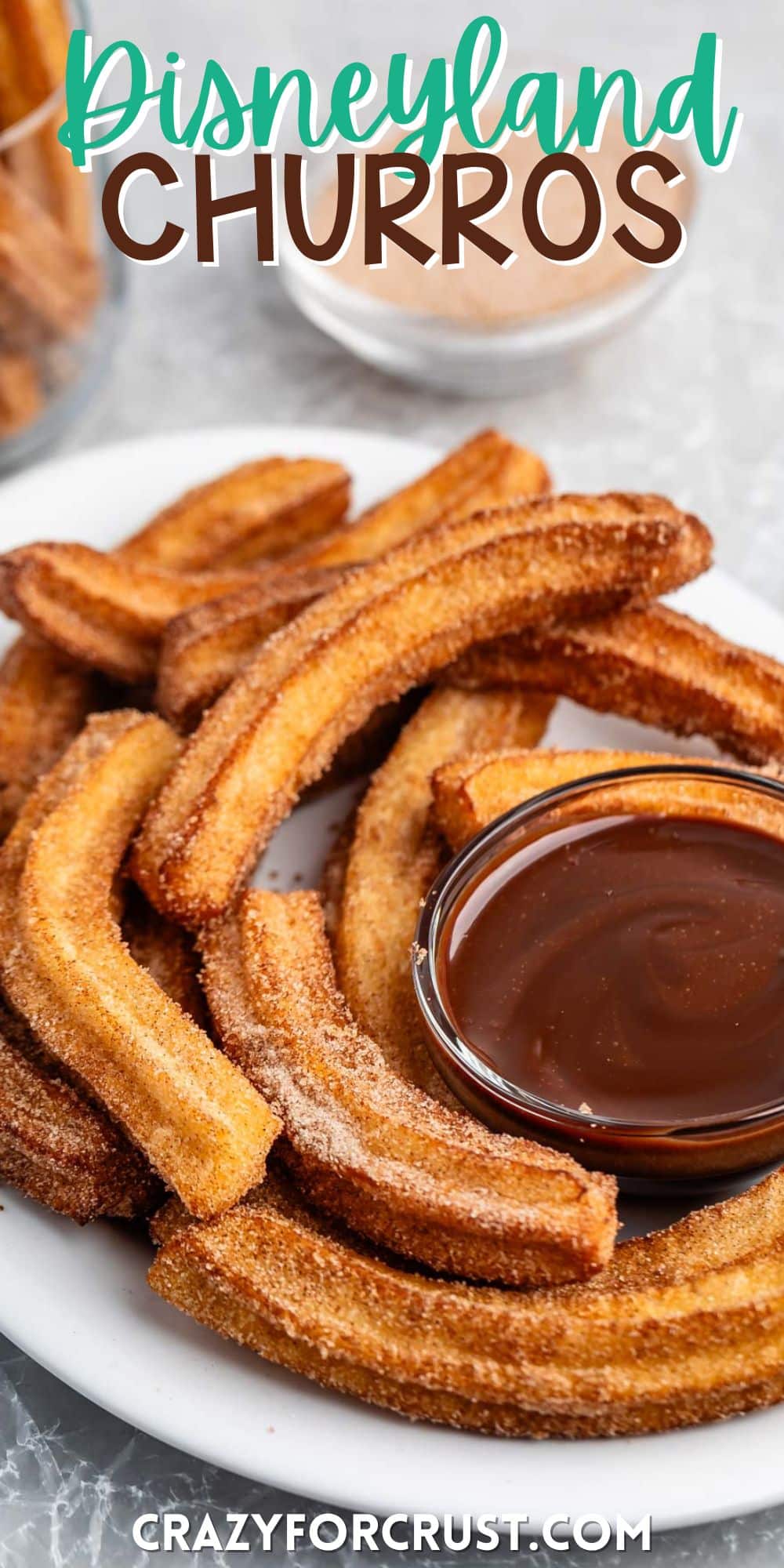 churros placed together on a white plate with a chocolate sauce with words on the image.