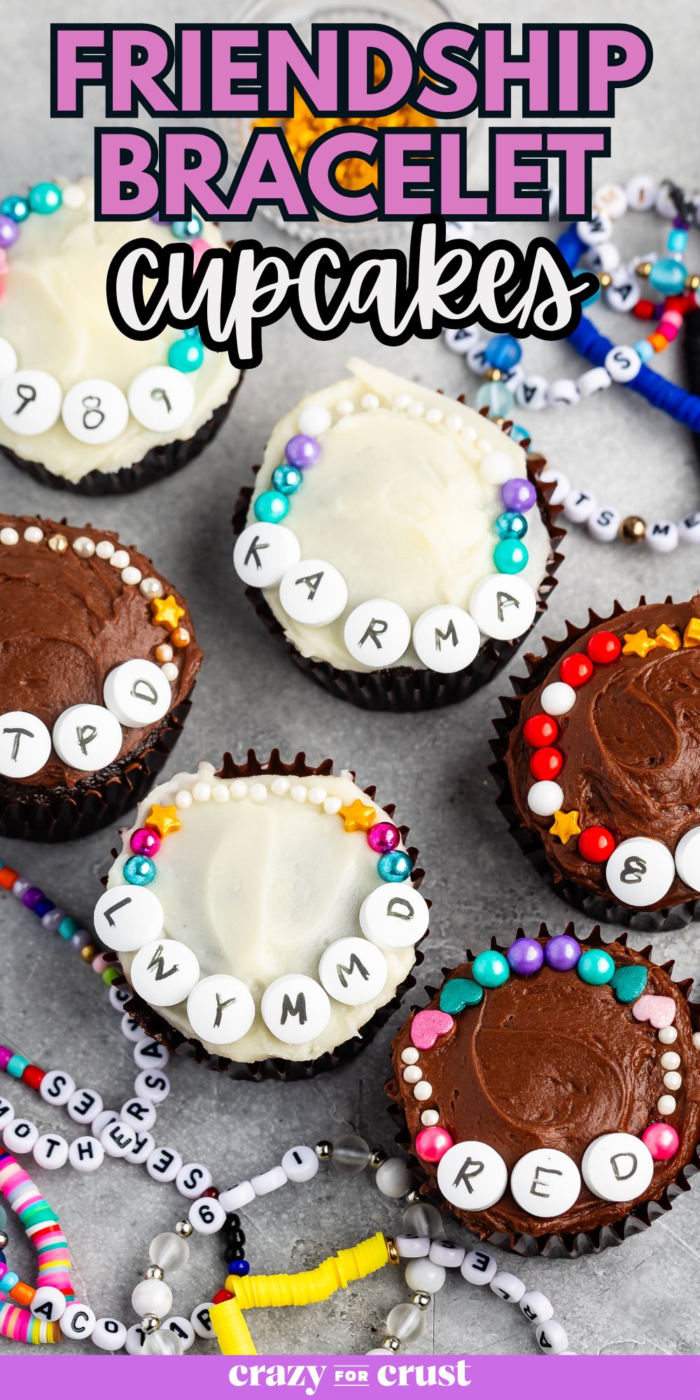 cucpakes on gray background frosted with white letters and sprinkles that look like friendship bracelets.