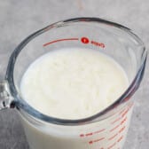 glass measuring cup of buttermilk.