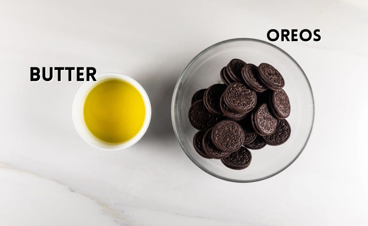 ingredients in Oreo cookie crust laid out on a white marble counter.