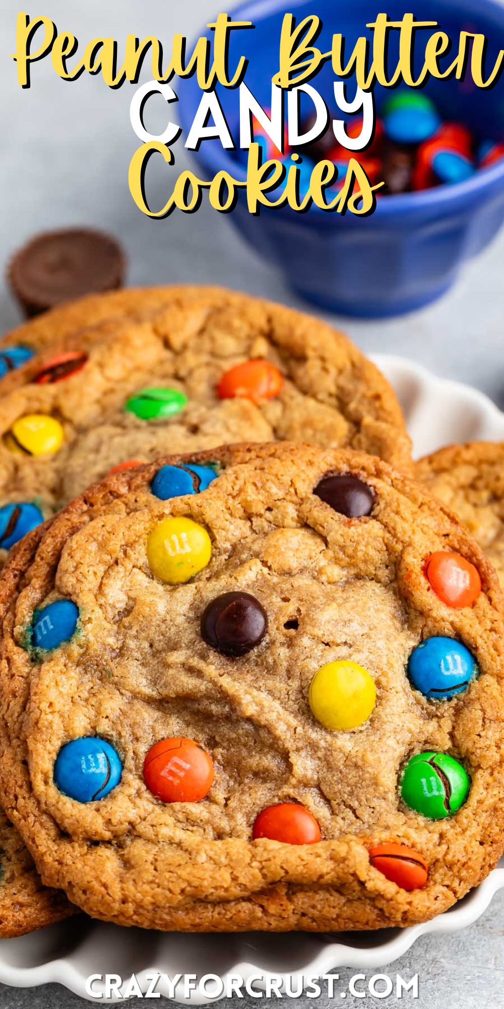 stacked peanut butter cookies with M&Ms baked into the cookies with words on the image.