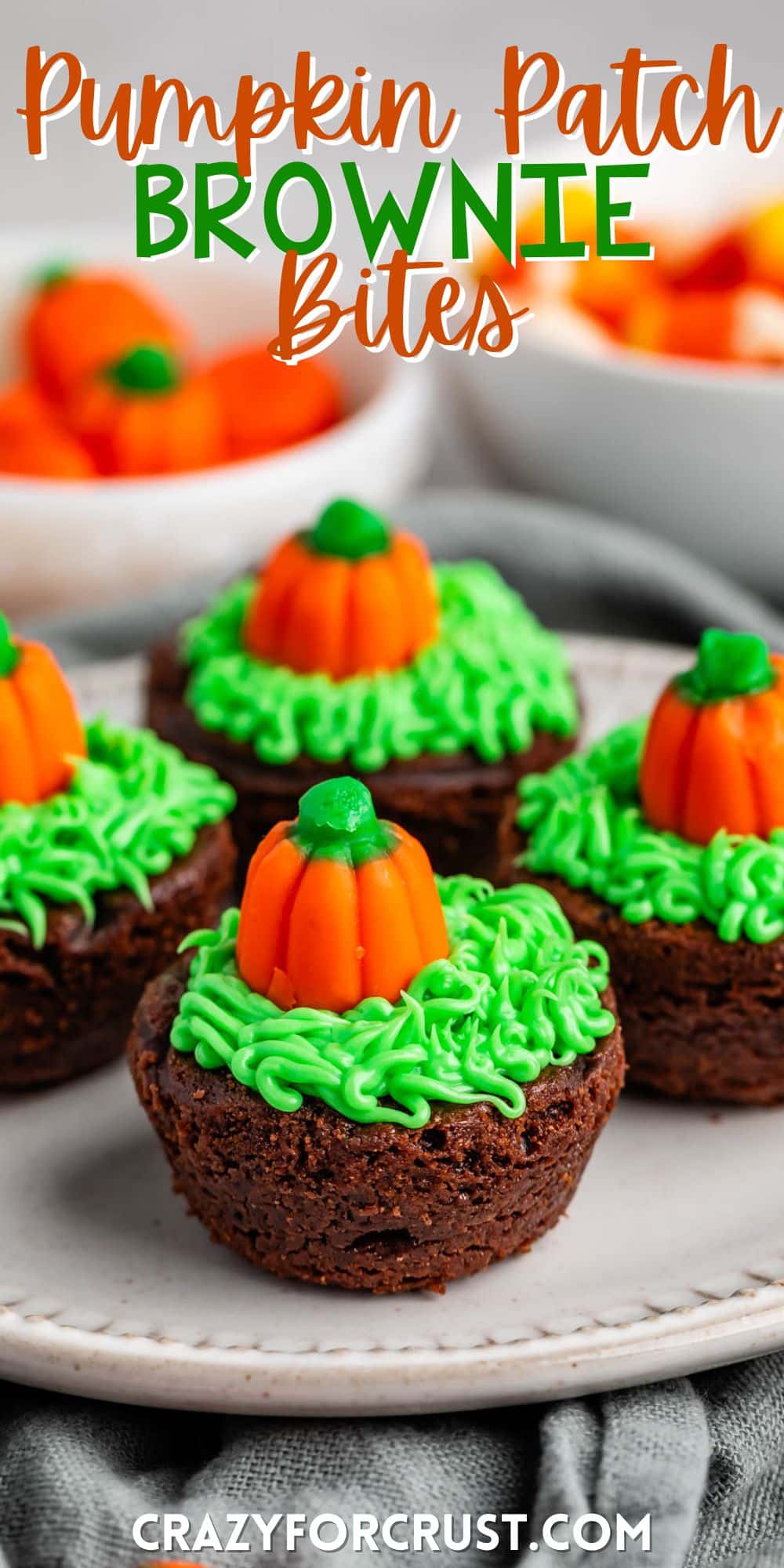 brownie bites topped with green frosting and a pumpkin candy corn with words on the image.