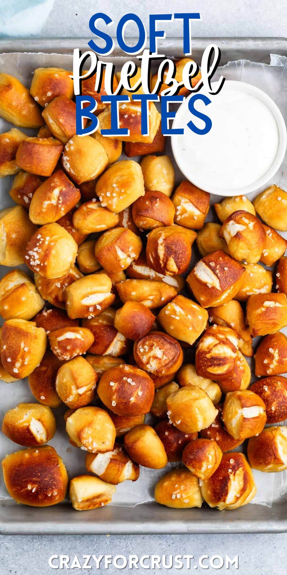 soft pretzel bites piled on top of each other with thick salt on top with words on the image.