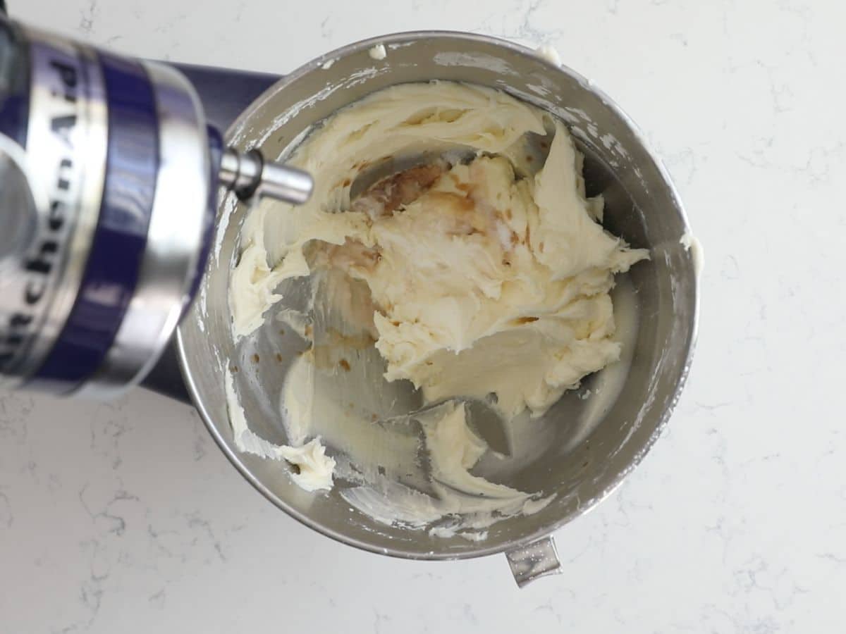 process shot of white chocolate frosting being made.