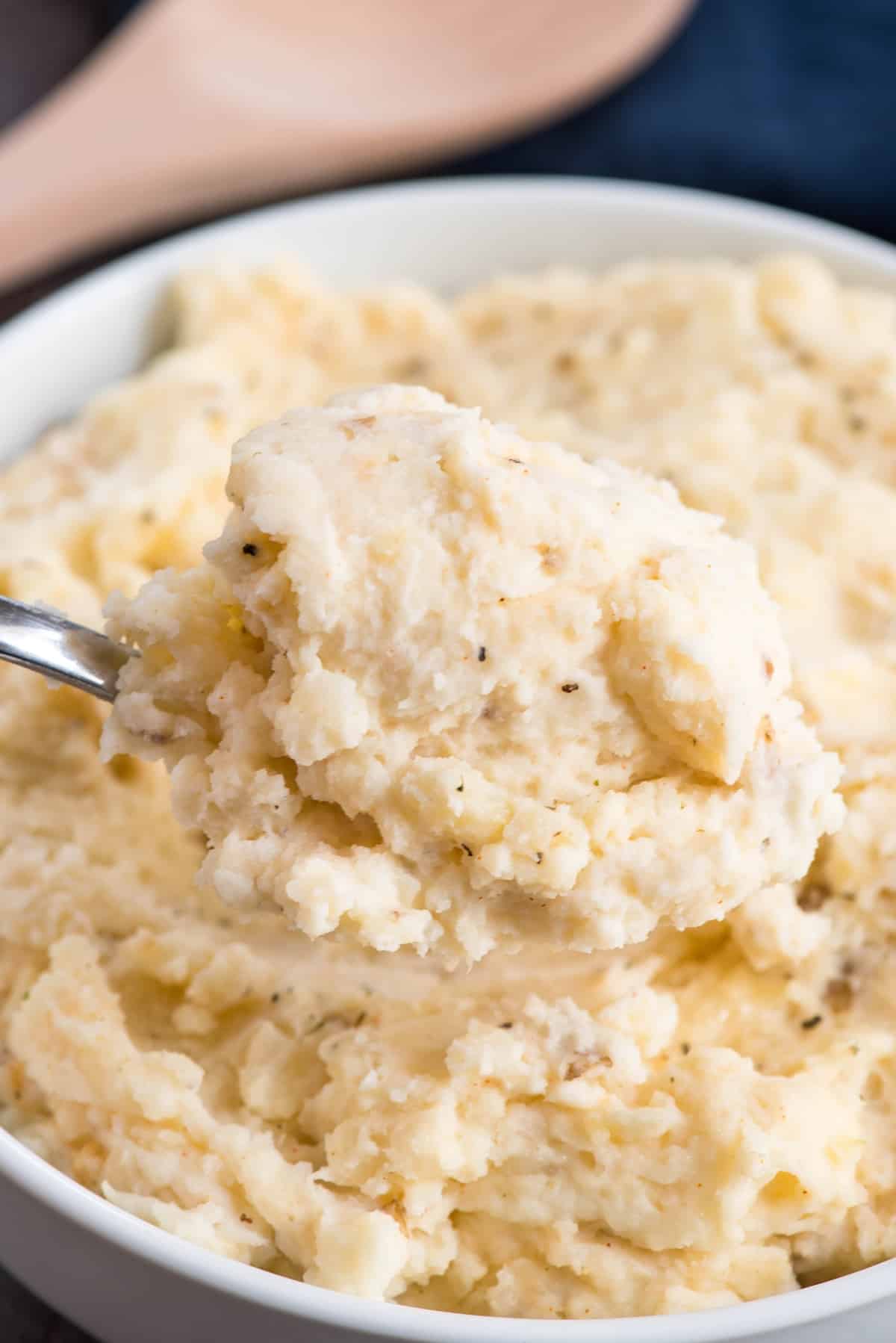 mashed potatoes in a white bowl.