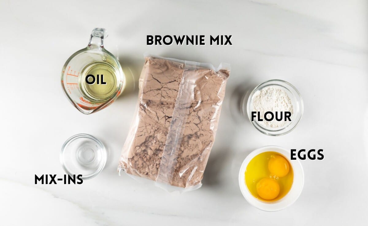 ingredients in brownie cookies laid out on a marble counter.