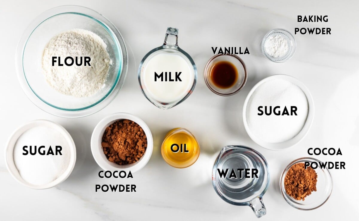 ingredients in crockpot cake laid out on a white counter.