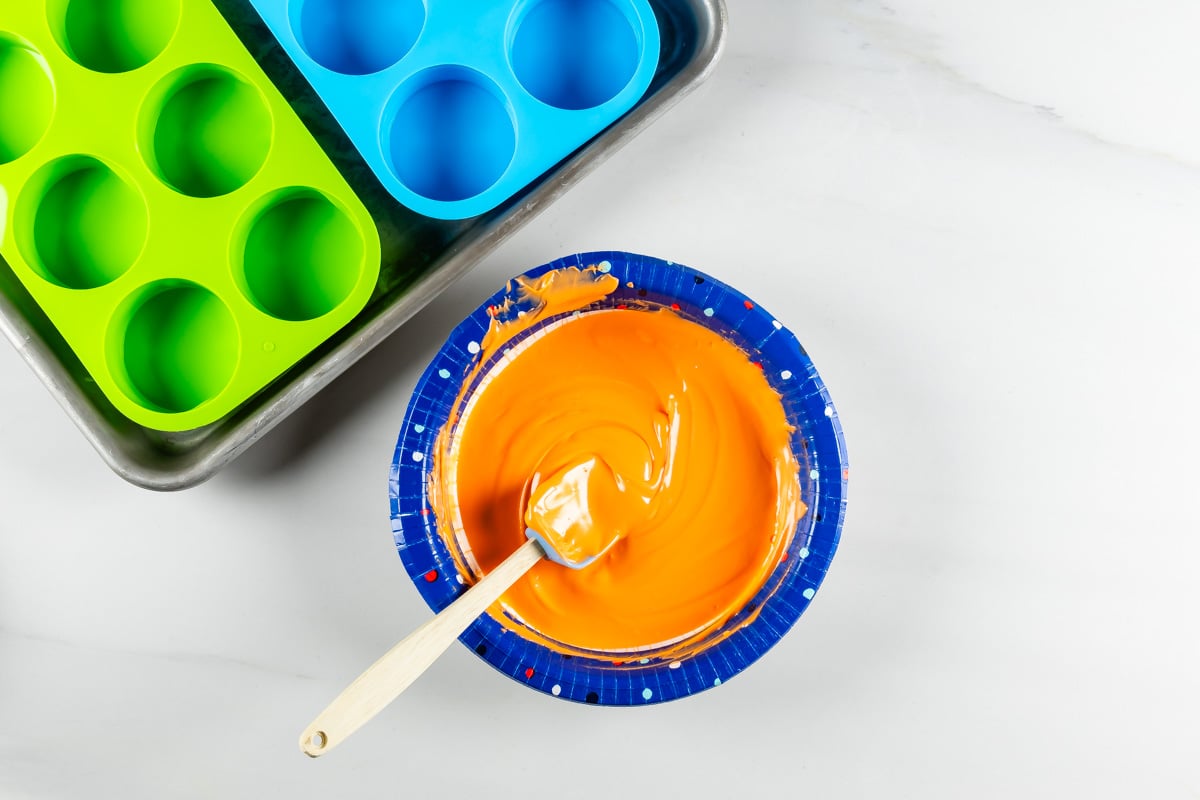 process shot of halloween Oreos being made.