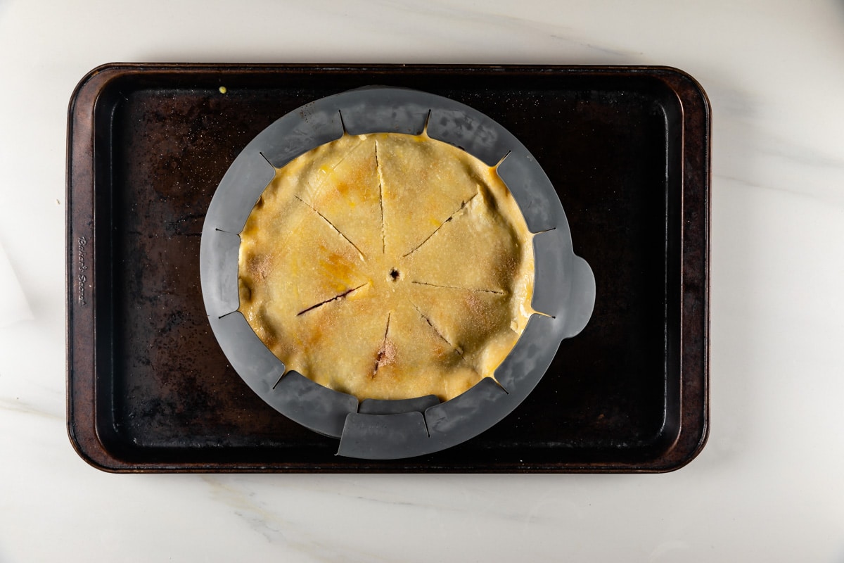 process shot of grape pie being made.