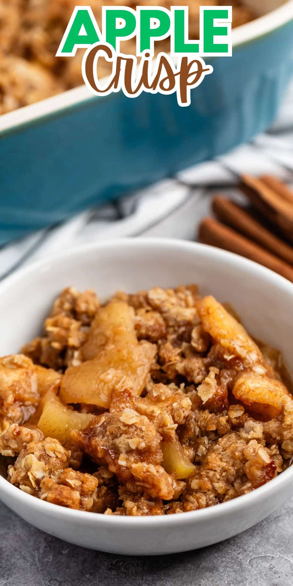 apple crisp in a white bowl with ice cream on top with words on the image.