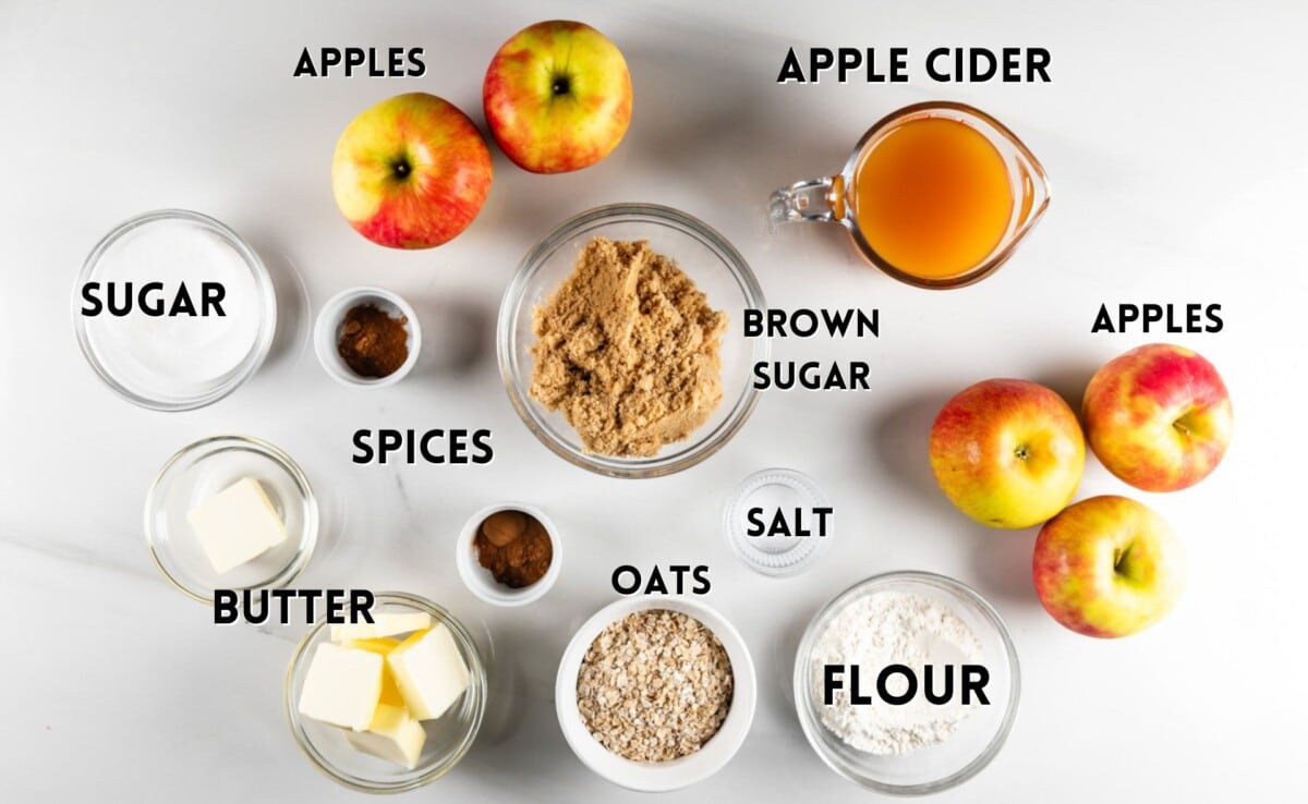 ingredients in apple crisp laid out on a white counter.