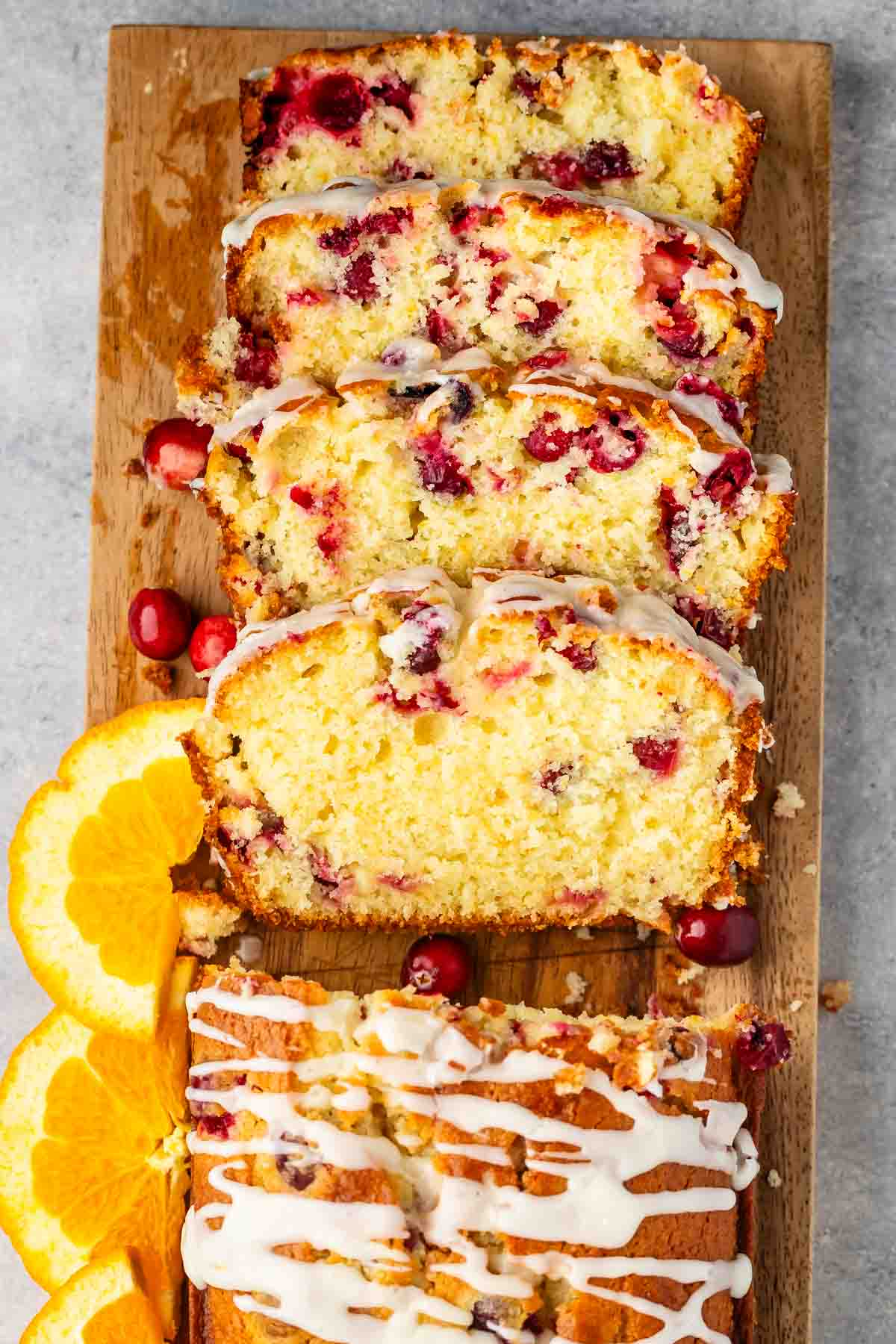 sliced cranberry bread on a cutting board.