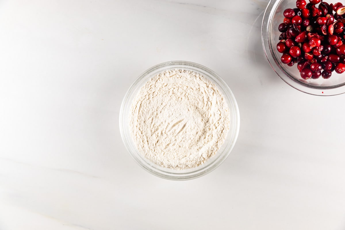 process shot of cranberry orange bread being made.