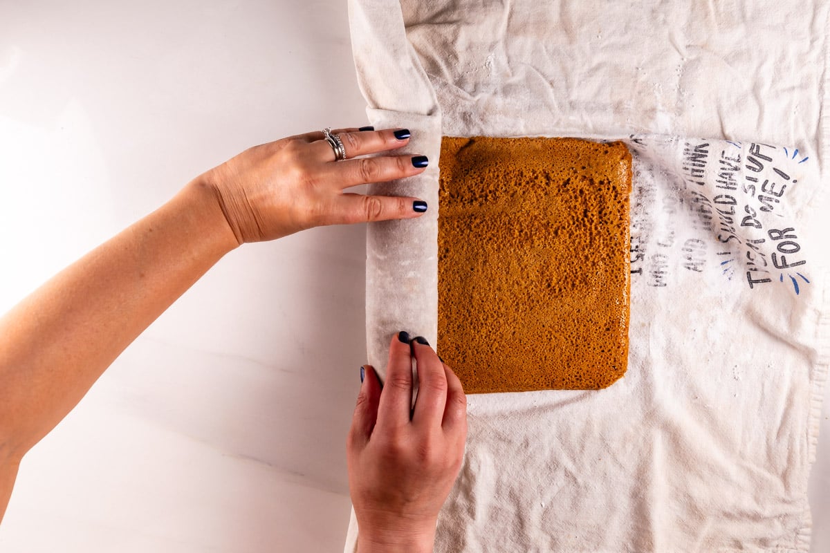 process shot of pumpkin roll being made.