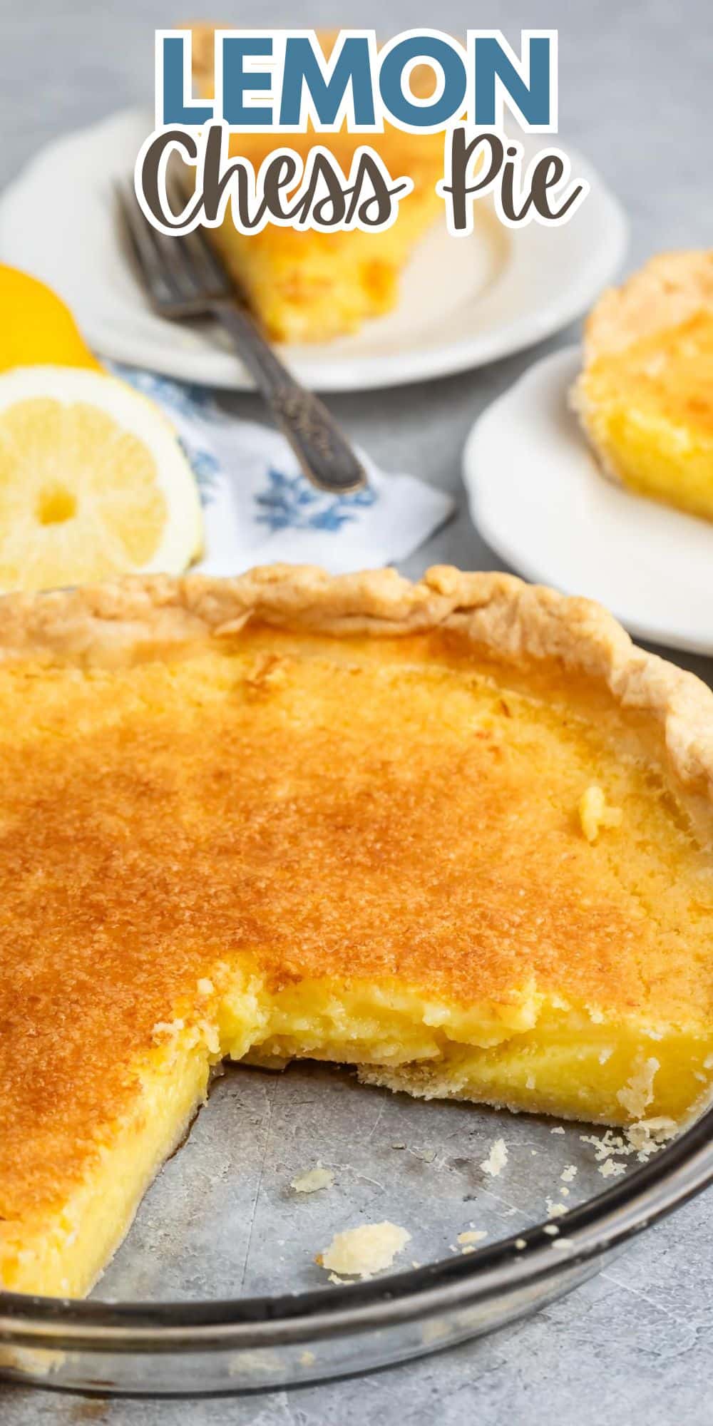 lemon chess pie one a white plate with a sliced lemon in the back with words on the image.