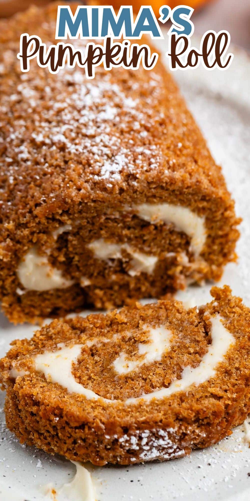 sliced pumpkin cake roll with a white buttercream in the center with words on the image.