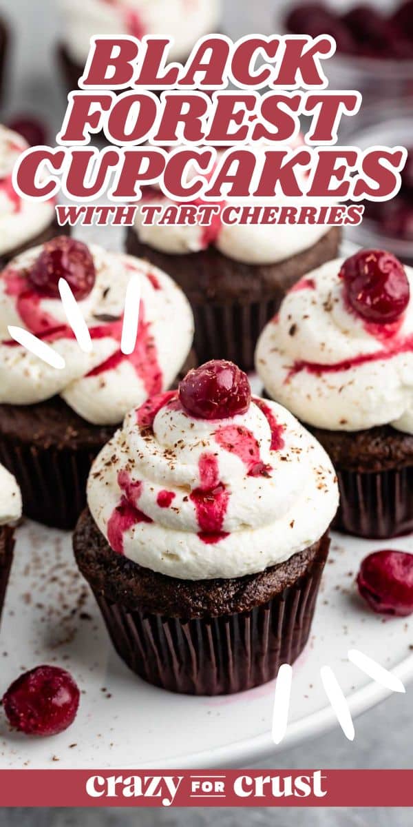 Chocolate cupcakes topped with whipped cream, cherry sauce, and a whole cherry. Text overlay reads Black Forest Cupcakes with Tart Cherries and Crazy for Crust.