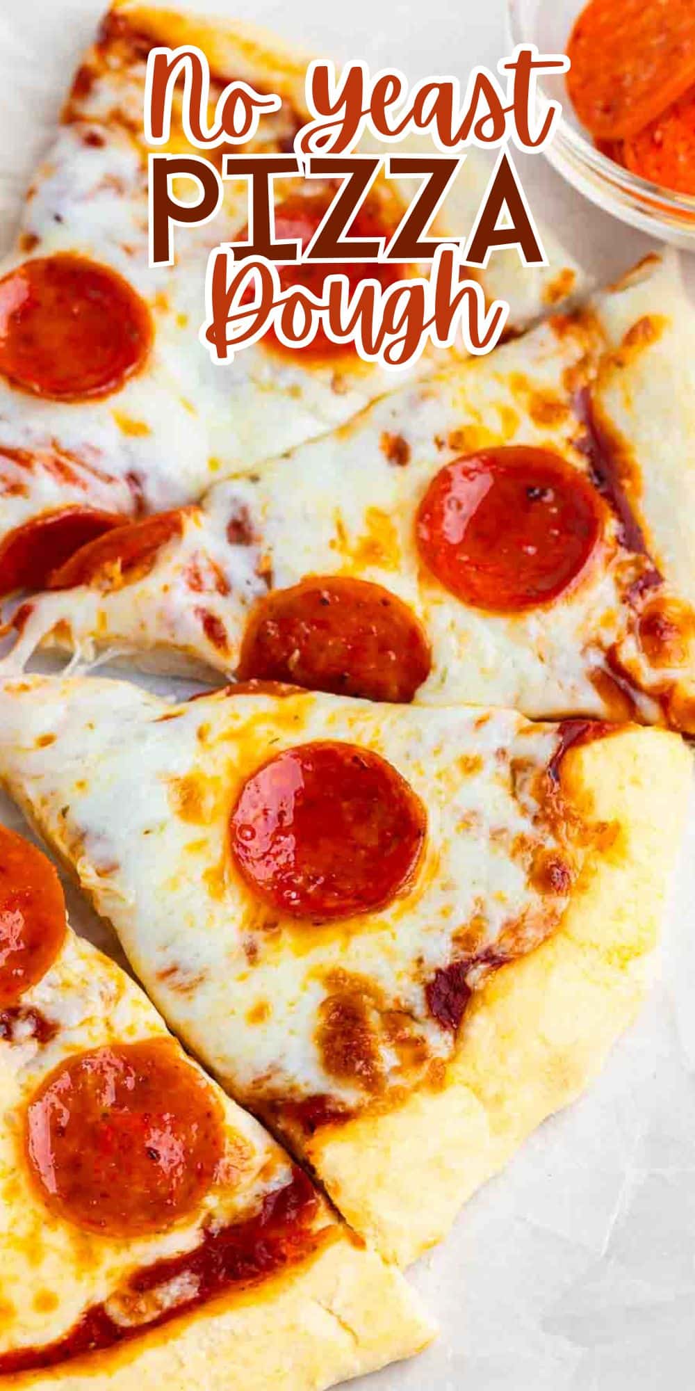 Close-up of pizza slices with melted cheese and pepperoni on a crust. Text overlay reads No yeast pizza dough. An orange napkin is partially visible in the top right corner.