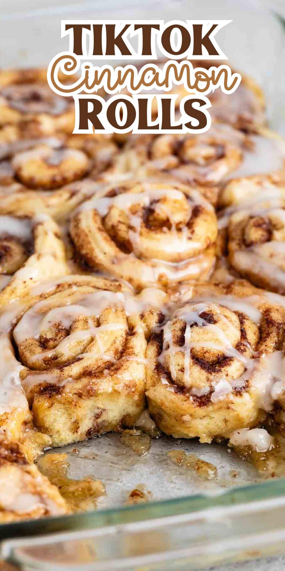 Close-up of freshly baked cinnamon rolls in a glass dish, topped with icing. The text TikTok Cinnamon Rolls is overlaid at the top. The rolls are golden brown with swirls of cinnamon visible.